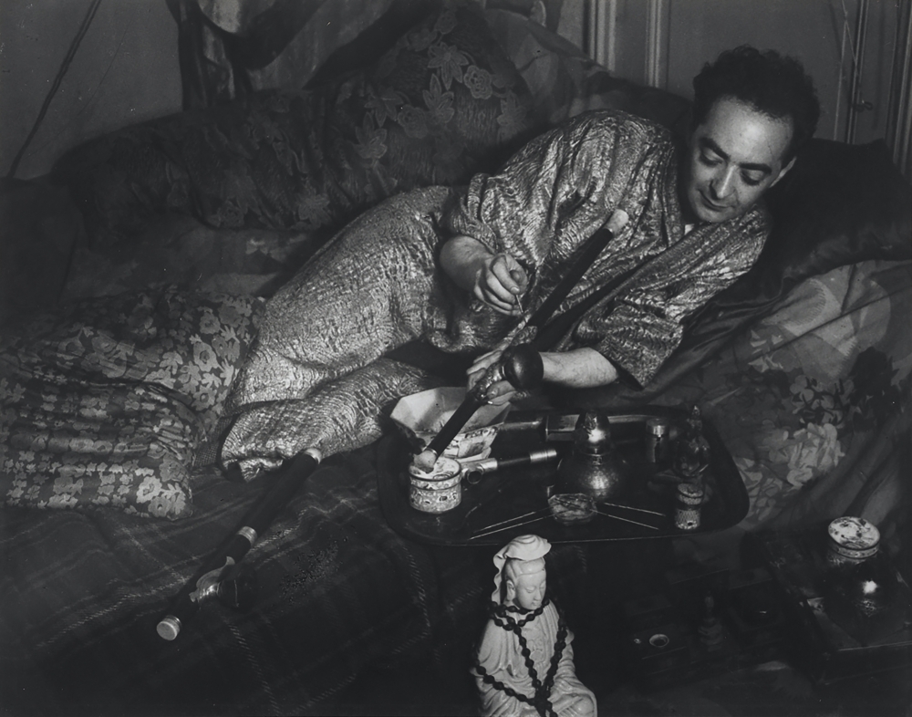Black and white photographic portrait of Brassaï wearing a kimono