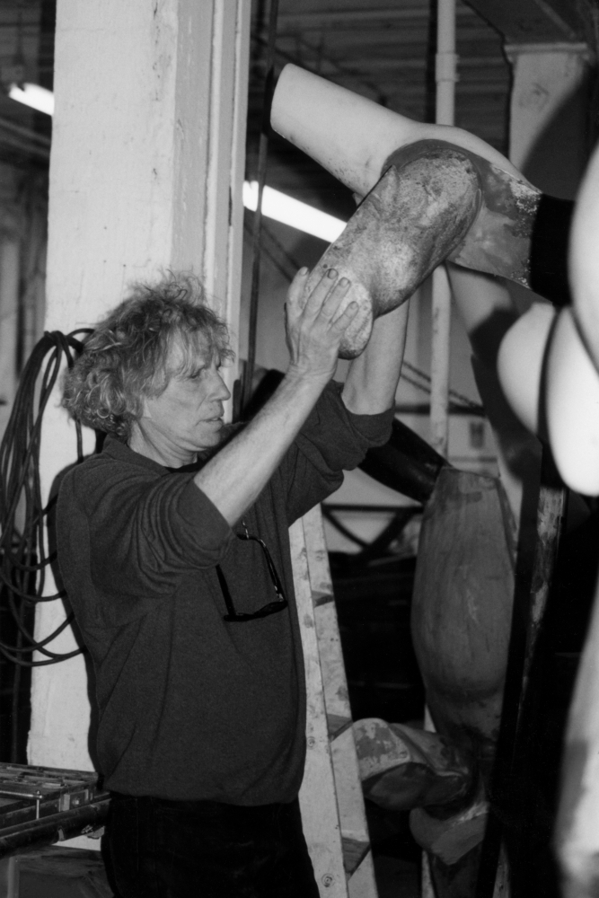 Black and white photograph of Dennis Oppenheim working