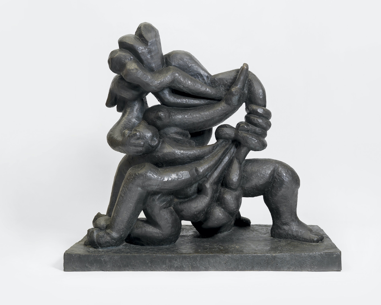 Bronze sculpture with contorted figures.