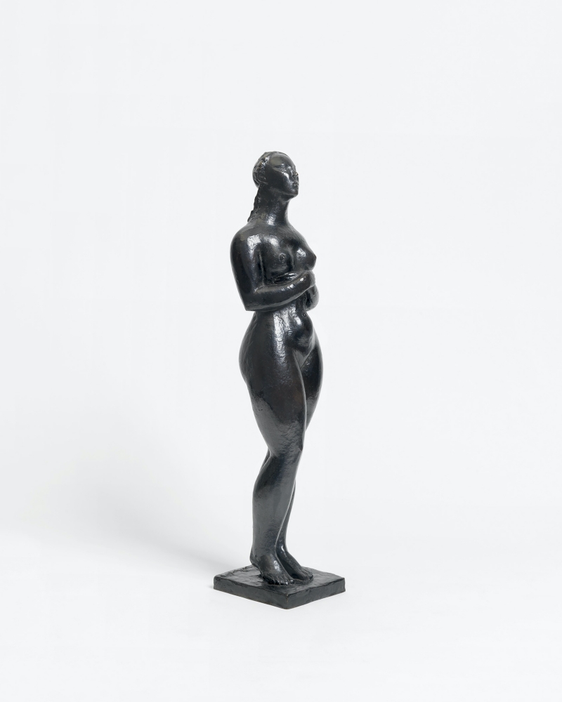 Bronze sculpture depicting a pregnant woman.