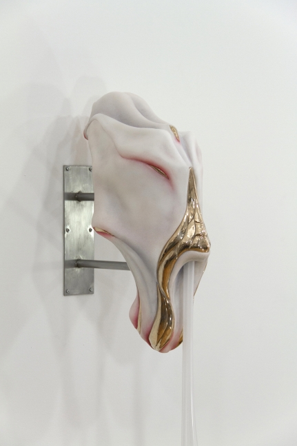Side view of white angular sculpture by Ivana Bašić with bronze details and blown glass drips reminiscent of skin and flesh.