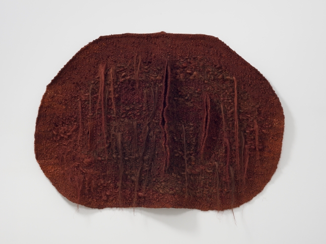 Horizontally oriented, oval shaped, red textile with slits by Magdalena Abakanowicz